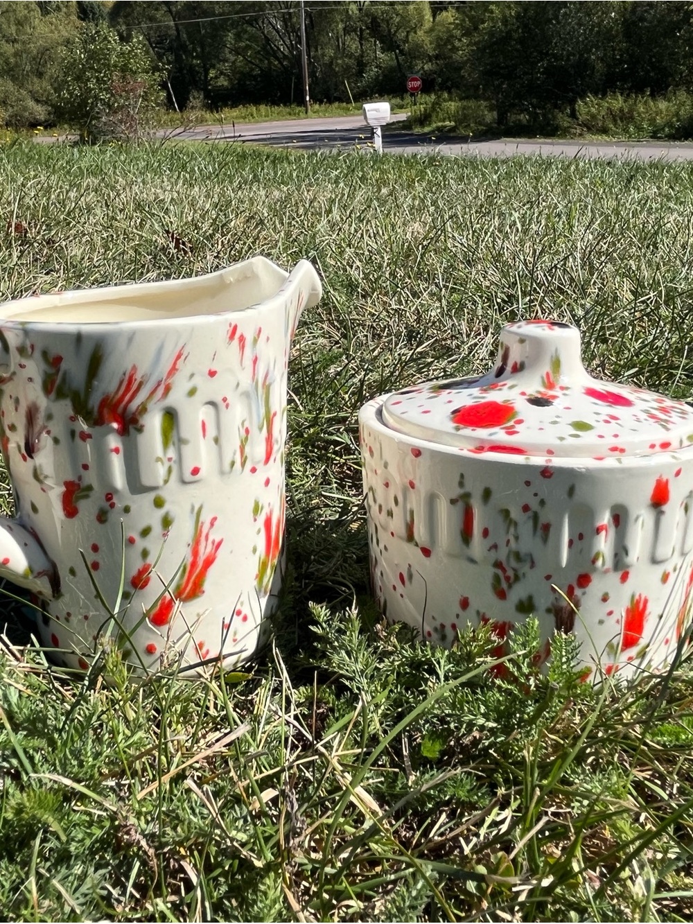 Cream Ceramic Pitcher and Lidded Sugar Bowl with Red and Green Splatter